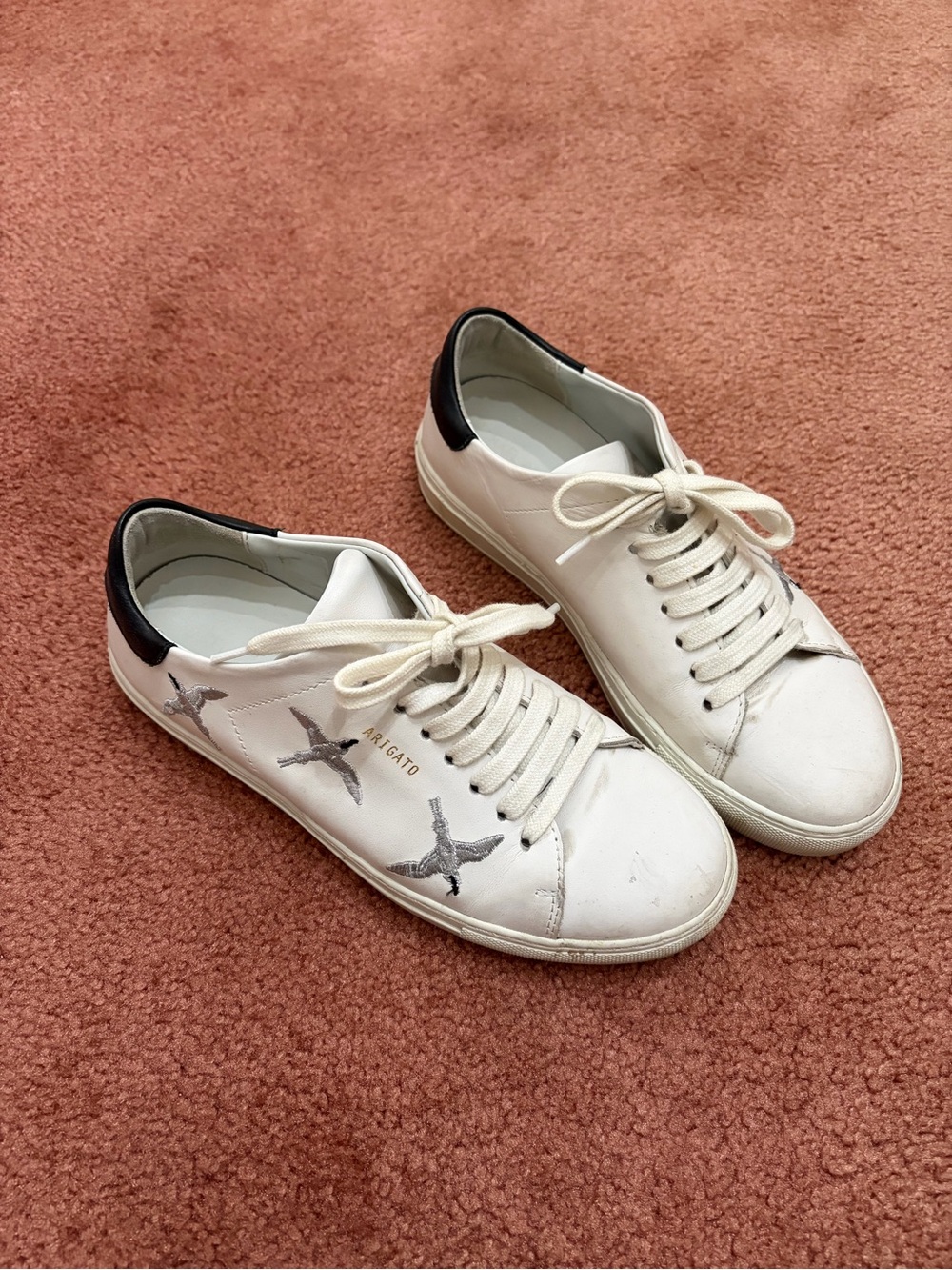 Axel Arigato White Leather Sneakers with Black Heel and Silver Bird Motif